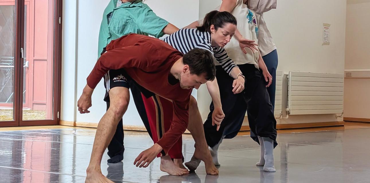 photo of a group of dancers in movement