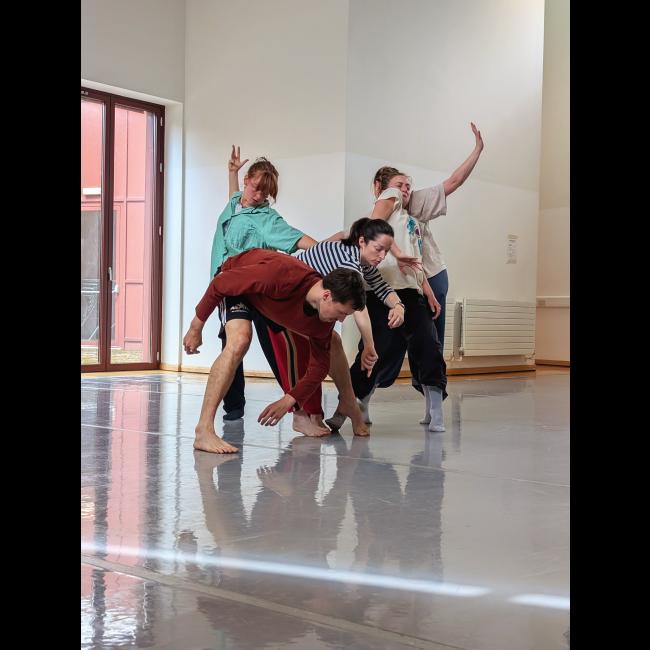 photo of a group of dancers in movement